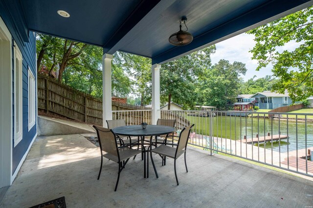 view of patio with outdoor dining area and a fenced backyard