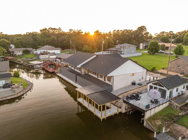 aerial view with a water view and a residential view