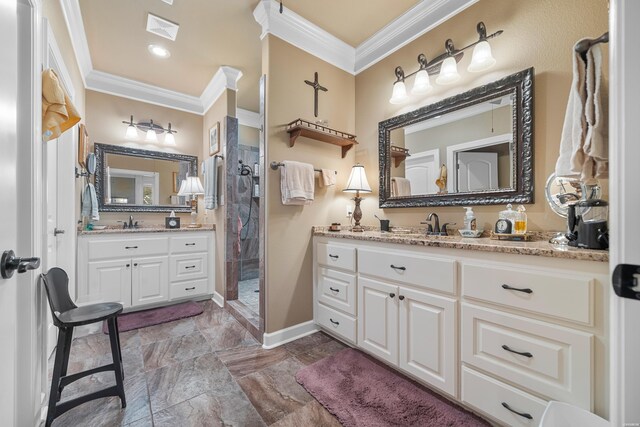 full bathroom featuring crown molding, two vanities, visible vents, and a sink