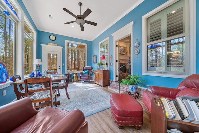 interior space with visible vents and ceiling fan