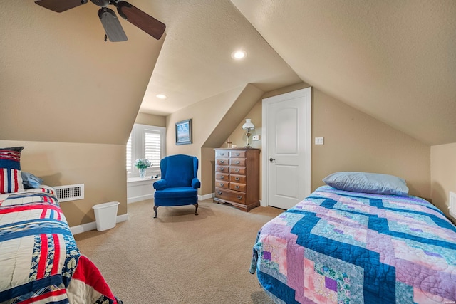 bedroom with lofted ceiling, baseboards, a textured ceiling, and carpet floors