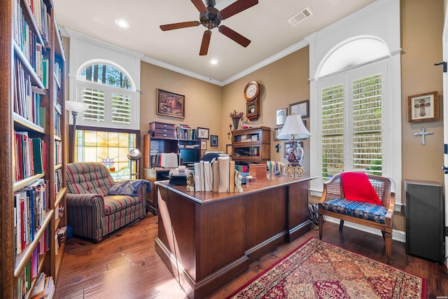 office area featuring a wealth of natural light, visible vents, crown molding, and ceiling fan