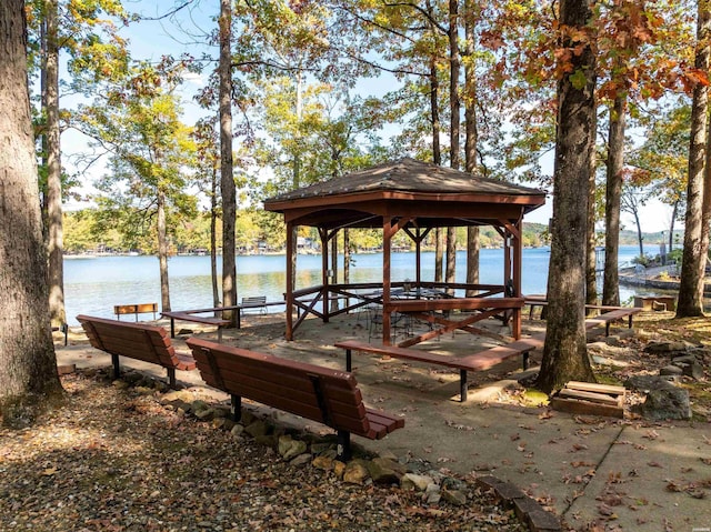 view of property's community with a gazebo and a water view