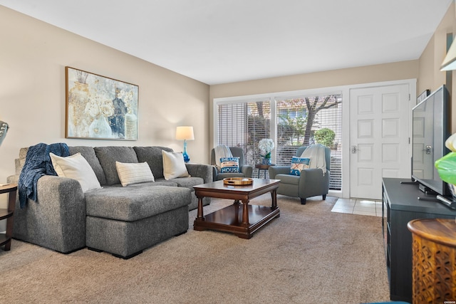 living area featuring light colored carpet and light tile patterned floors