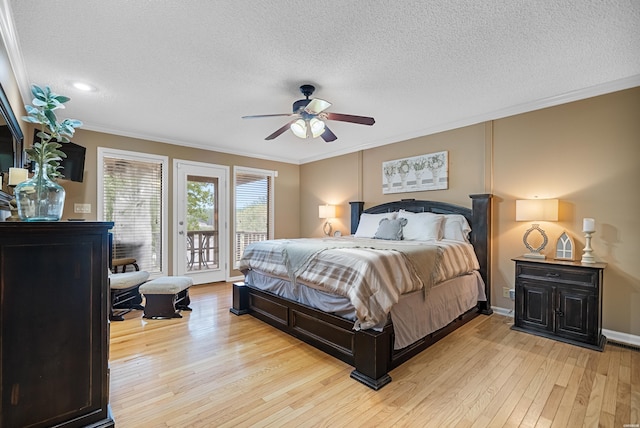 bedroom featuring access to exterior, light wood finished floors, and crown molding