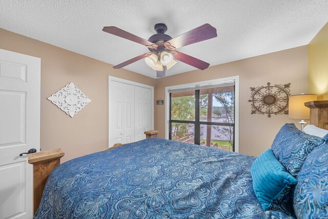 bedroom with ceiling fan, a closet, and a textured ceiling