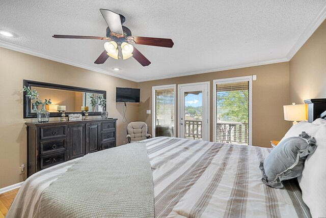 bedroom with a textured ceiling, ornamental molding, wood finished floors, and access to exterior