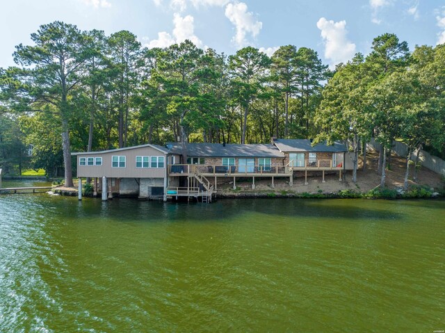 view of dock with a deck with water view