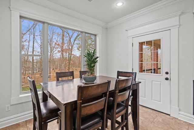 dining room with baseboards, recessed lighting, and crown molding