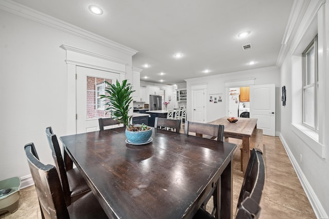 dining area featuring recessed lighting, baseboards, washer / dryer, visible vents, and ornamental molding