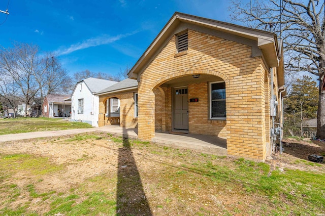 view of front of home with brick siding