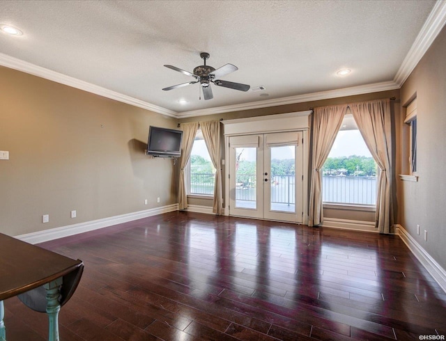 1380 Airport Rd Unit A4, Hot Springs, AR 71913 - unfurnished living room featuring crown molding, a textured ceiling, french doors, baseboards, and wood finished floors