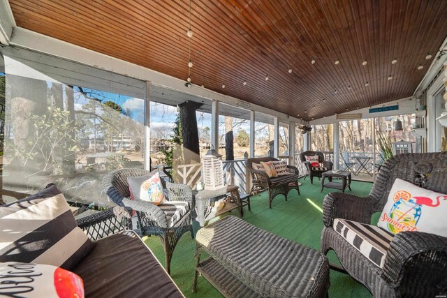 sunroom / solarium with vaulted ceiling and wooden ceiling