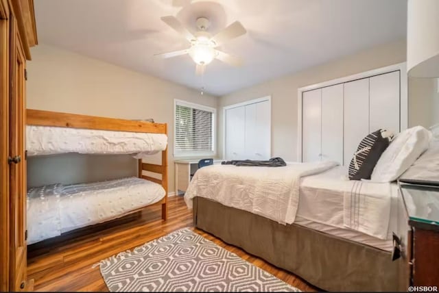200 Hamilton Oaks Dr Unit J-2, Hot Springs, AR 71913 - bedroom with two closets, wood finished floors, and a ceiling fan