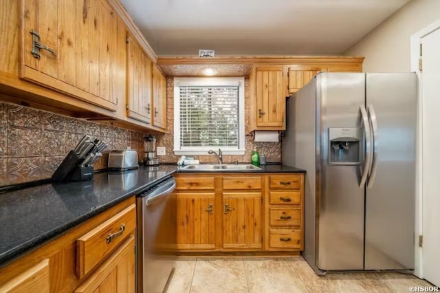 200 Hamilton Oaks Dr Unit J-2, Hot Springs, AR 71913 - kitchen with appliances with stainless steel finishes, a sink, backsplash, light tile patterned floors, and brown cabinetry