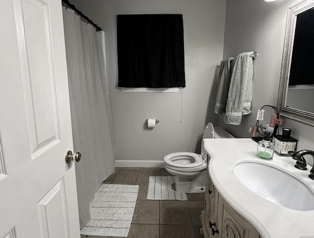 full bathroom with toilet, tile patterned flooring, baseboards, and vanity