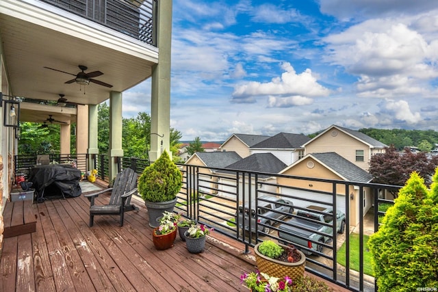 wooden terrace featuring a ceiling fan