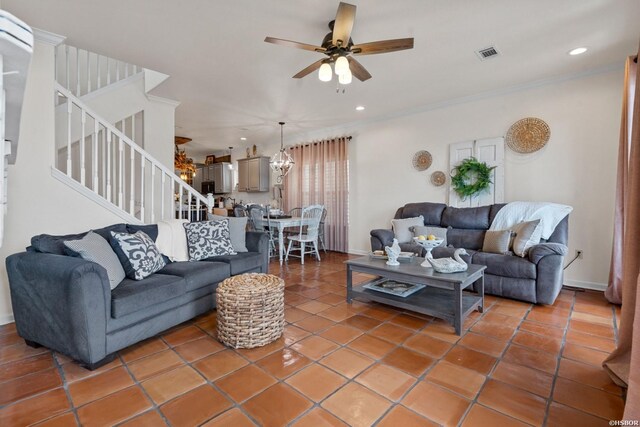 tiled living area with crown molding, recessed lighting, visible vents, ceiling fan, and stairs