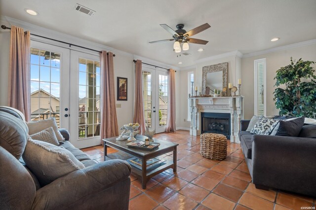 tiled living room featuring recessed lighting, a fireplace, visible vents, french doors, and crown molding