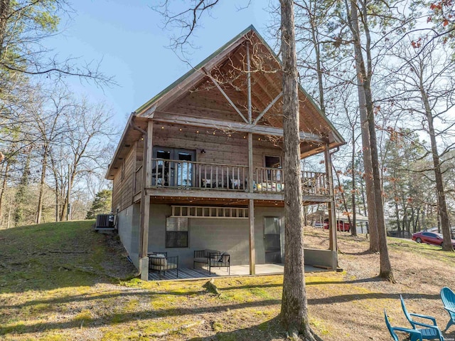 back of property with a patio area and cooling unit