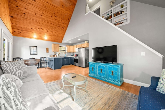 living room featuring high vaulted ceiling, stairway, light wood finished floors, baseboards, and wood ceiling