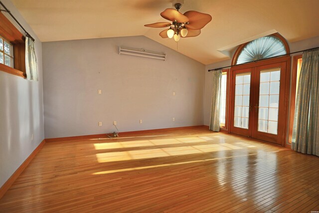 81 End Of Trail Rd, Mount Ida, AR 71957 - spare room featuring french doors, lofted ceiling, ceiling fan, light wood-type flooring, and baseboards