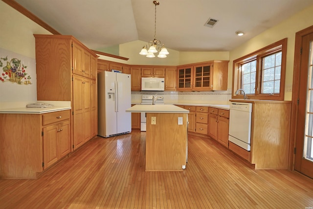 81 End Of Trail Rd, Mount Ida, AR 71957 - kitchen featuring white appliances, lofted ceiling, a chandelier, light wood-style flooring, and light countertops