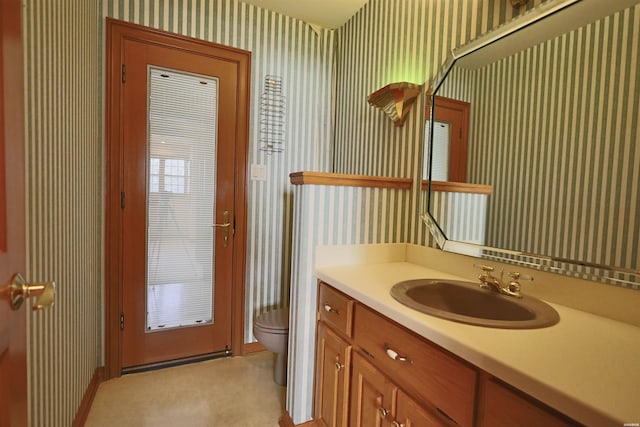 81 End Of Trail Rd, Mount Ida, AR 71957 - bathroom with wallpapered walls, toilet, vanity, and baseboards