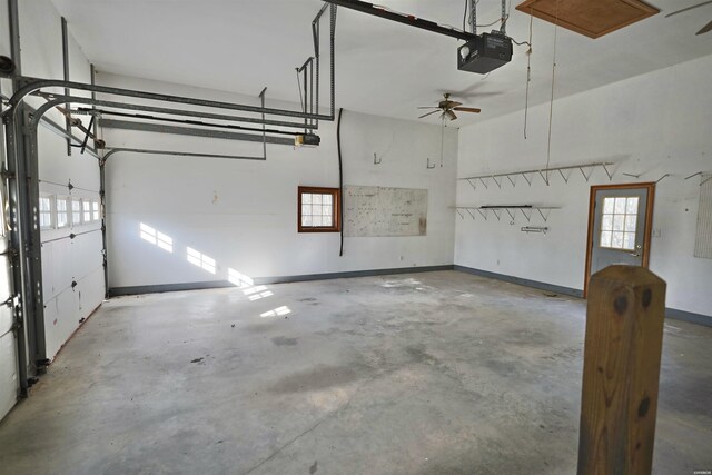 81 End Of Trail Rd, Mount Ida, AR 71957 - garage with a garage door opener, a ceiling fan, and baseboards