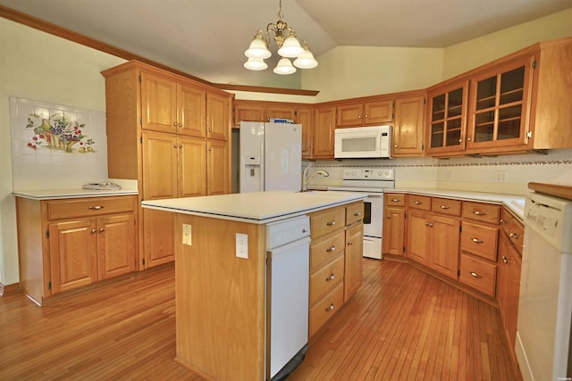 81 End Of Trail Rd, Mount Ida, AR 71957 - kitchen with white appliances, light wood-style floors, a chandelier, light countertops, and vaulted ceiling