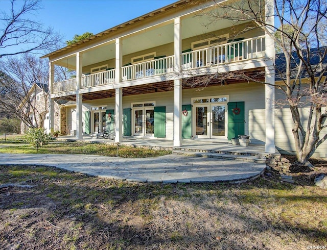 rear view of house featuring french doors and a patio