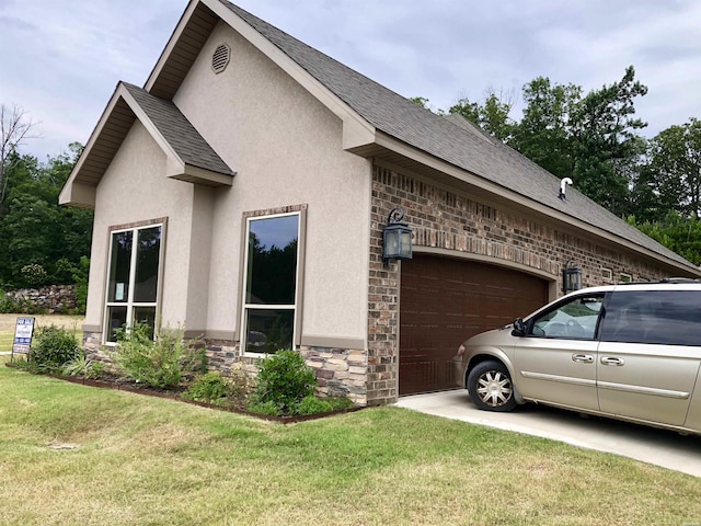 view of home's exterior featuring a garage, a shingled roof, stone siding, a lawn, and stucco siding