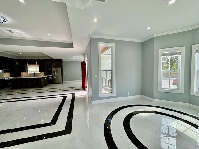 interior space featuring marble finish floor, baseboards, crown molding, and recessed lighting