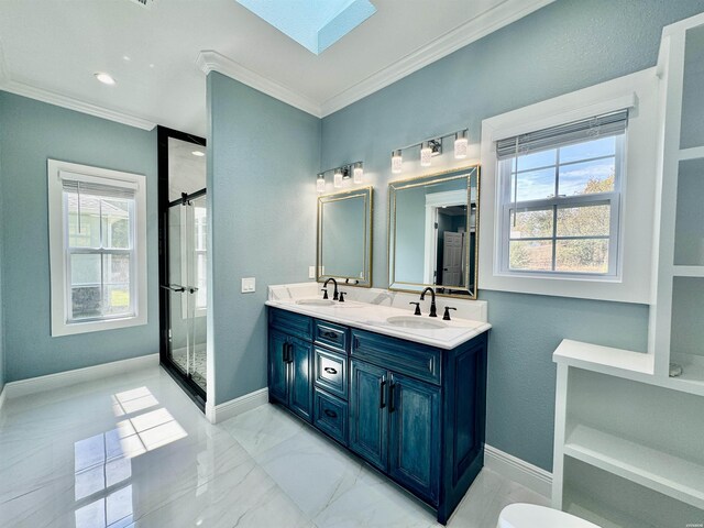 full bathroom featuring ornamental molding, a skylight, a sink, and baseboards