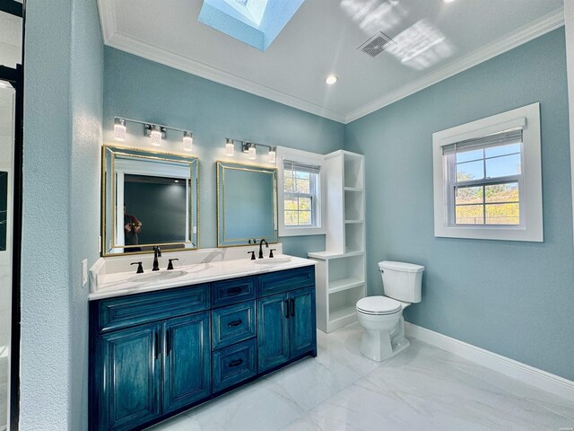 full bath featuring a skylight, ornamental molding, and a sink