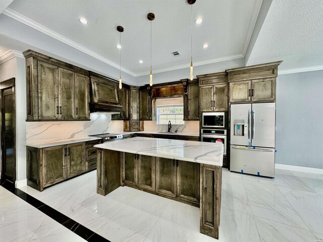 kitchen with light stone counters, stainless steel appliances, visible vents, a center island, and decorative light fixtures