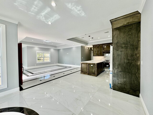 interior space featuring baseboards, marble finish floor, a tray ceiling, crown molding, and recessed lighting