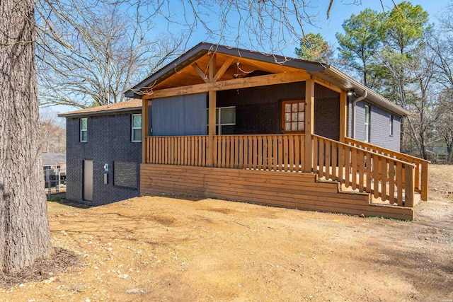 chalet / cabin with covered porch