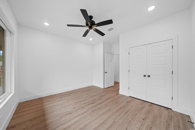 unfurnished bedroom featuring baseboards, recessed lighting, visible vents, and light wood-style floors