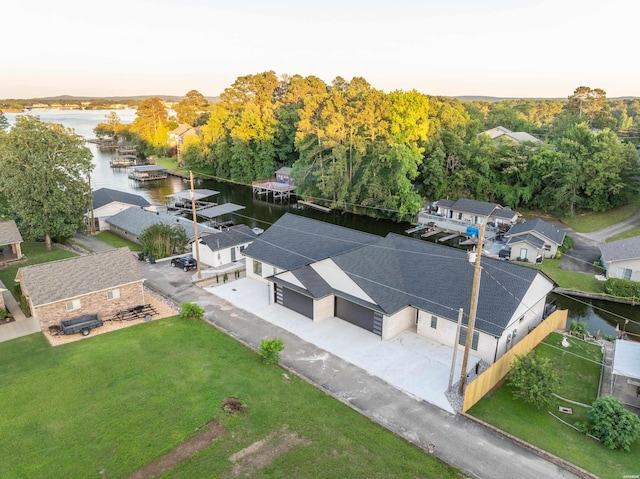 drone / aerial view with a water view and a residential view