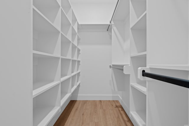 spacious closet with wood finished floors