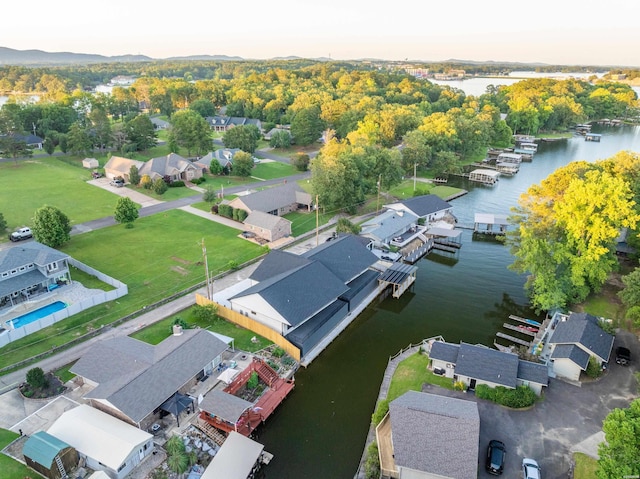 drone / aerial view featuring a residential view and a water view