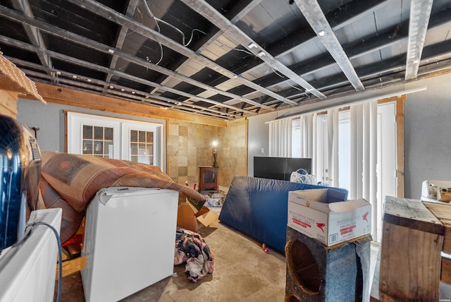 1638 Thornton Fry, Hot Springs, AR 71913 - interior space with a wood stove, unfinished concrete floors, and french doors
