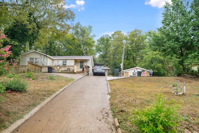 view of front of property with driveway, a front lawn, and central air condition unit