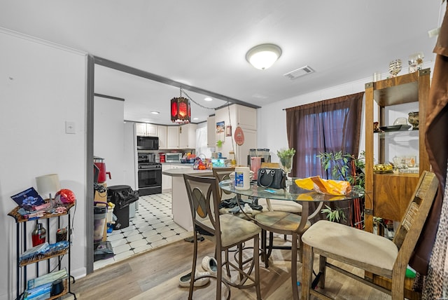 1638 Thornton Fry, Hot Springs, AR 71913 - dining area featuring light wood-style flooring, visible vents, and a toaster