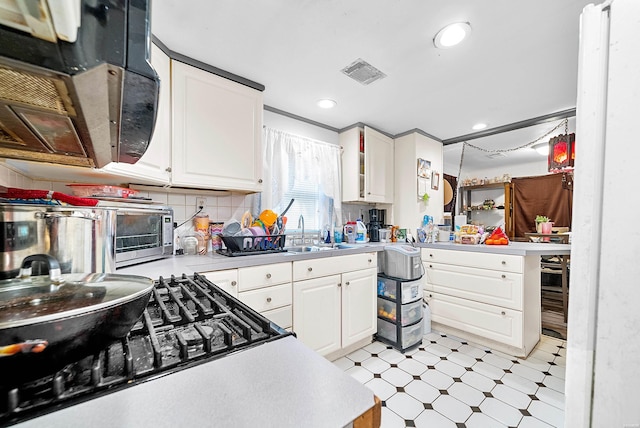 1638 Thornton Fry, Hot Springs, AR 71913 - kitchen featuring light countertops, white cabinetry, and a sink