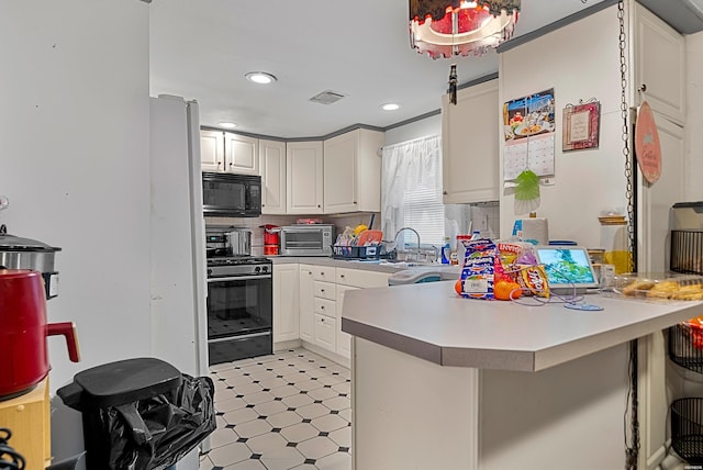 1638 Thornton Fry, Hot Springs, AR 71913 - kitchen featuring a peninsula, black microwave, a breakfast bar, and range with gas cooktop