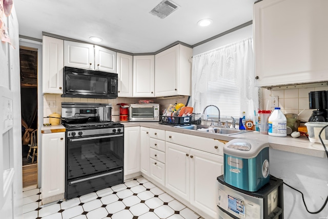 1638 Thornton Fry, Hot Springs, AR 71913 - kitchen featuring black microwave, stainless steel gas range oven, a sink, white cabinetry, and light countertops