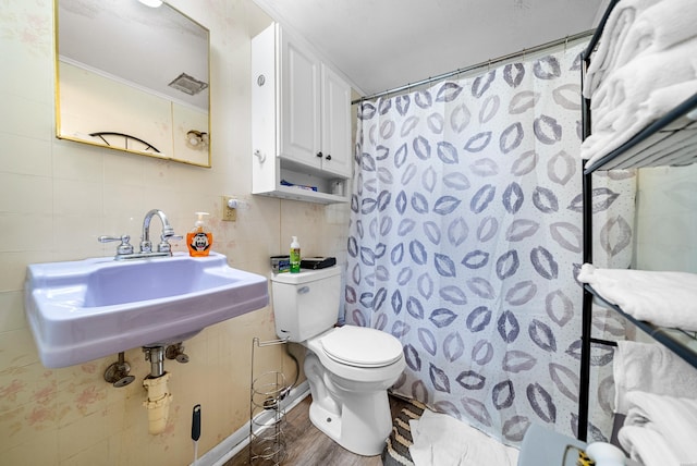 1638 Thornton Fry, Hot Springs, AR 71913 - full bathroom with tile walls, toilet, a sink, wood finished floors, and a shower with curtain