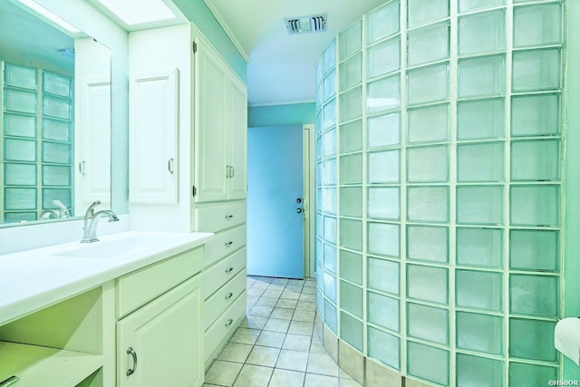 bathroom featuring ornamental molding, tile patterned flooring, visible vents, and vanity